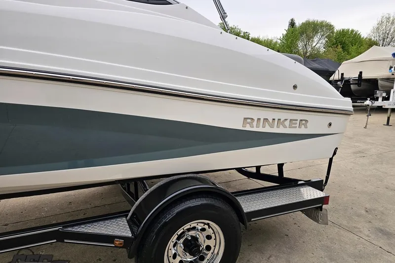 Slide: The Image of 2020 Rinker 19QX BR boat on trailer, side view, outdoors. - 32