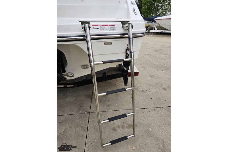 Slide: The Image of 2020 Rinker 19QX BR boat with extended stainless steel swim ladder. - 42