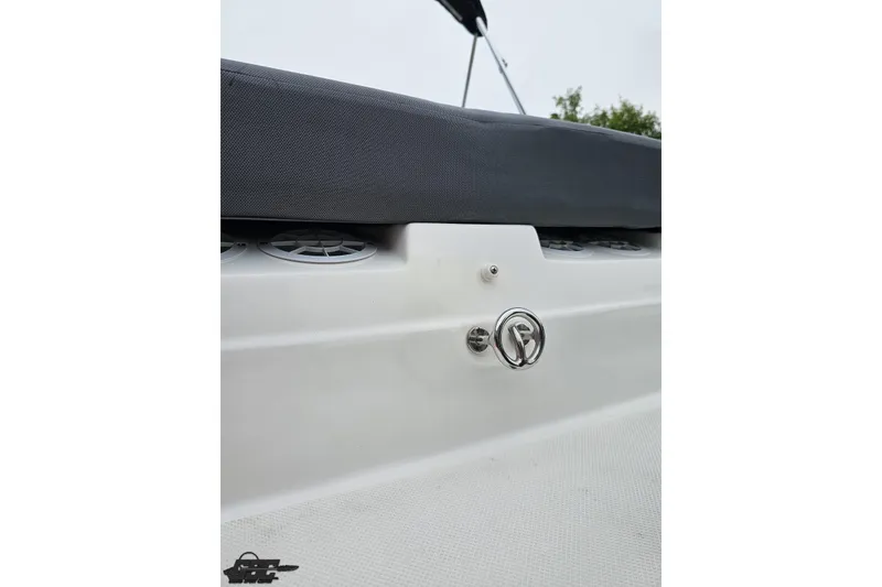 Slide: The Image of 2020 Rinker 19QX BR boat interior detail with speaker and upholstery. - 44