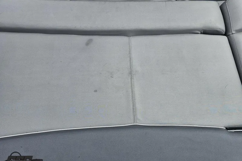 Slide: The Image of Gray upholstery on a 2020 Rinker 19QX BR boat seat. - 49