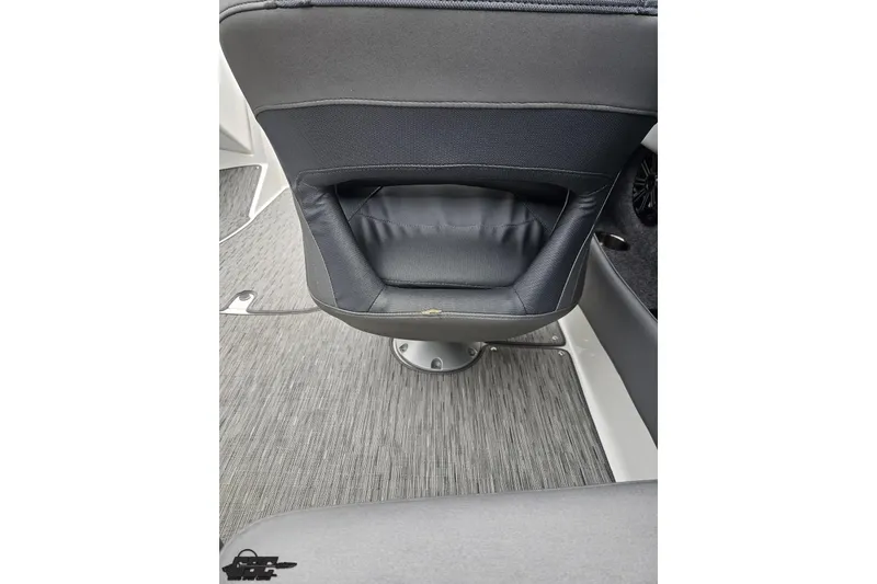 Slide: The Image of Interior of 2020 Rinker 19QX BR boat showing seat back and flooring. - 58