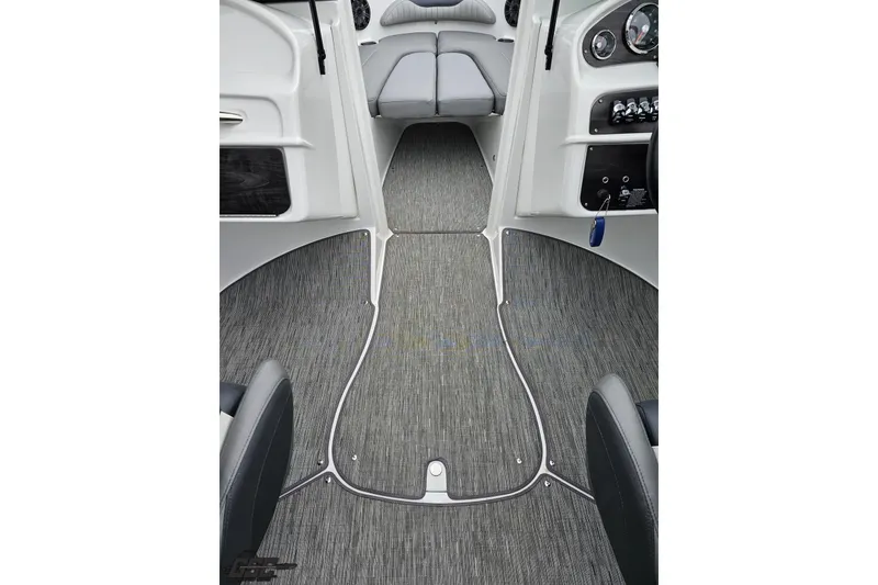 Slide: The Image of 2020 Rinker 19QX BR boat interior with sleek gray flooring and modern dashboard design. - 62