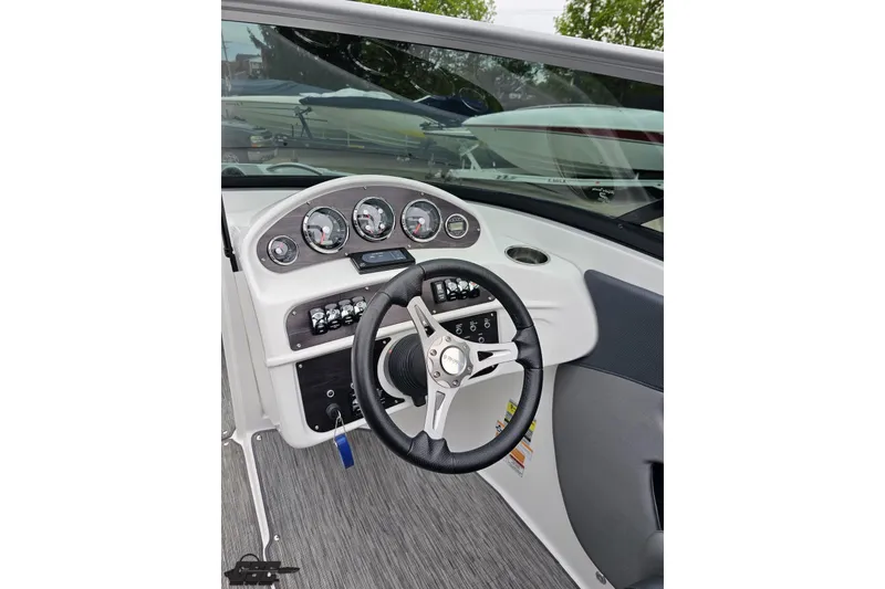 Slide: The Image of 2020 Rinker 19QX BR boat dashboard with steering wheel and instrument panel. - 65