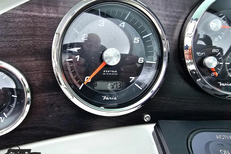 Slide: The Image of Close-up of 2020 Rinker 19QX BR boat dashboard gauges. - 68