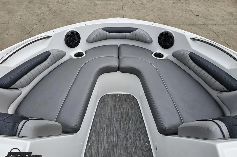 Slide: The Image of 2020 Rinker 19QX BR boat interior with gray cushioned seating and cup holders. - 74