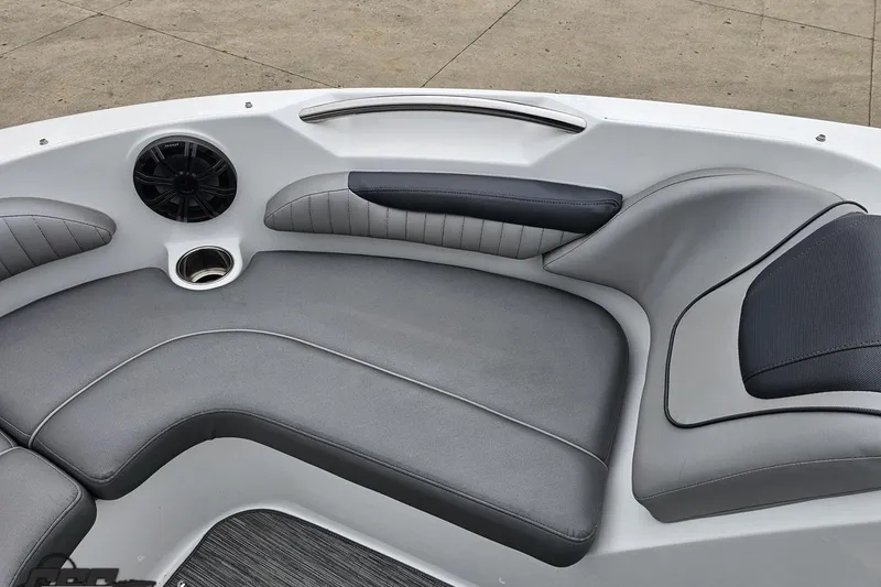 Slide: The Image of 2020 Rinker 19QX BR boat interior with gray seating and speaker. - 75