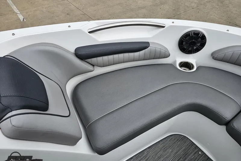 Slide: The Image of 2020 Rinker 19QX BR boat interior with gray seating and speaker. - 76
