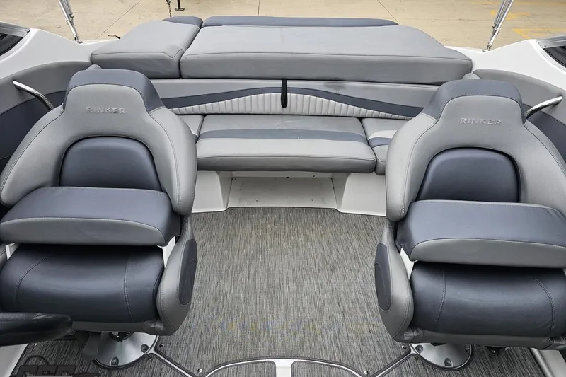 Slide: The Image of 2020 Rinker 19QX BR boat interior with gray and black seating. - 80
