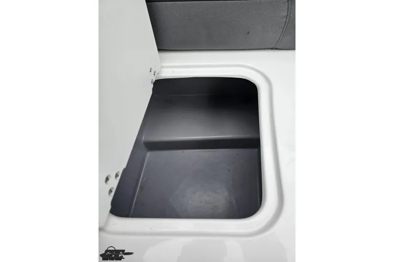 Slide: The Image of Storage compartment in a 2020 Rinker 19QX BR boat, featuring a sleek interior design. - 87
