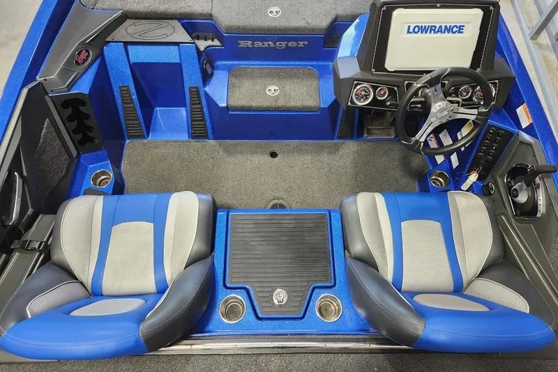 Slide: The Image of 2022 Ranger Z519 Cup-Equipped boat interior with blue seats and Lowrance electronics. - 4
