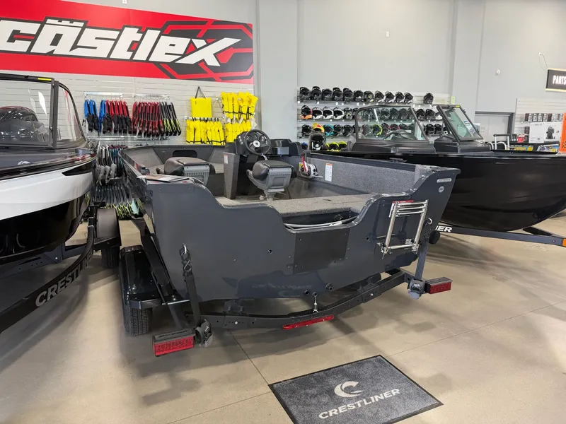 Slide: The Image of 2026 Crestliner 1650 Kodiak SC in showroom with accessories. - 3