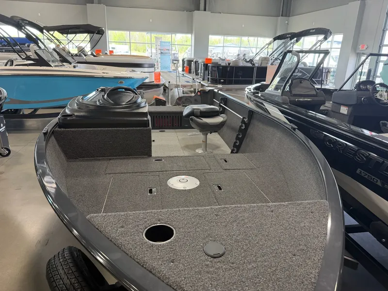 Slide: The Image of 2026 Crestliner 1650 Kodiak SC boat in showroom. - 7