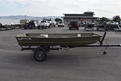 The Image of 2025 Lowe L1240 Jon boat on trailer in parking lot. - 0