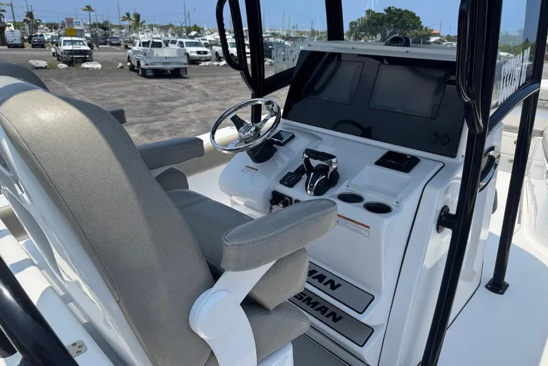 Slide: The Image of 2021 Sportsman Open 282 Center Console boat interior with steering wheel and controls. - 12