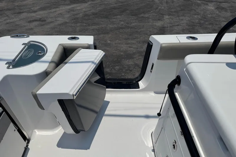 Slide: The Image of 2021 Sportsman Open 282 Center Console boat interior with seating and storage compartments. - 17
