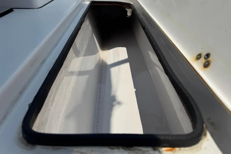 Slide: The Image of Storage compartment on a 2021 Sportsman Open 282 Center Console boat. - 19