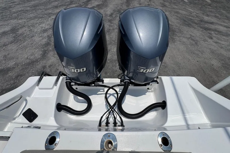 Slide: The Image of Twin Yamaha 300 engines on a 2021 Sportsman Open 282 Center Console boat. - 20