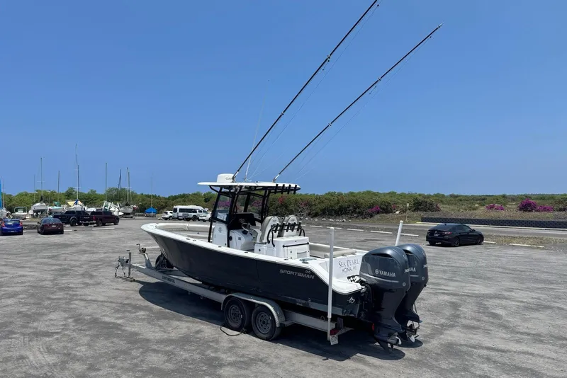 Slide: The Image of 2021 Sportsman Open 282 Center Console boat on trailer in parking lot. - 3
