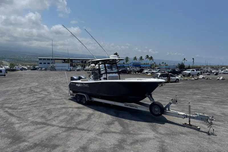 Slide: The Image of 2021 Sportsman Open 282 Center Console boat on trailer in parking lot. - 7