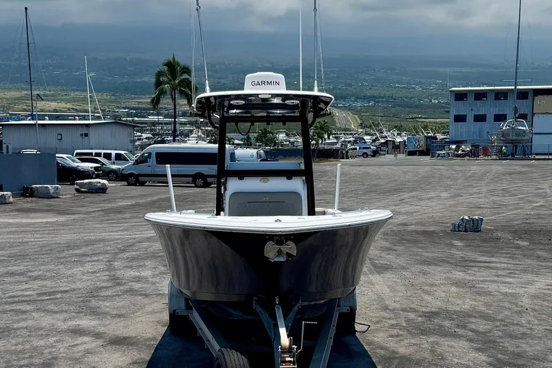 Slide: The Image of 2021 Sportsman Open 282 Center Console boat on trailer in marina parking lot. - 8