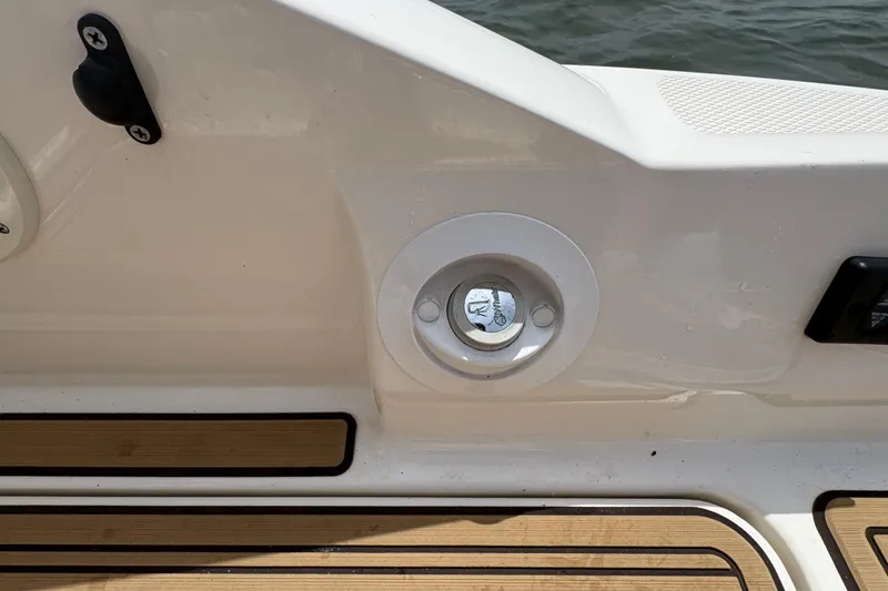 Slide: The Image of 2021 Sea Ray SDX 270 boat deck detail with water access port. - 19