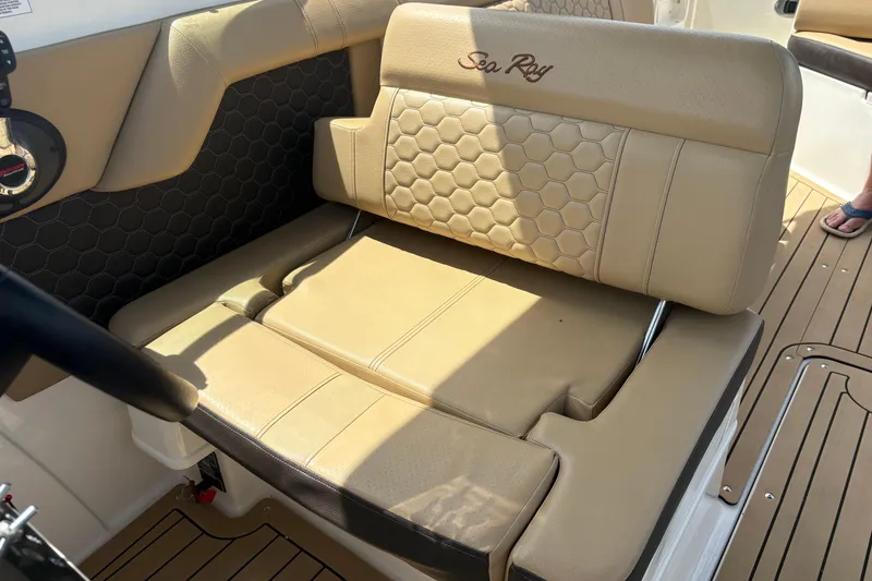 Slide: The Image of 2021 Sea Ray SDX 270 dashboard with steering wheel, navigation display, and controls. - 5