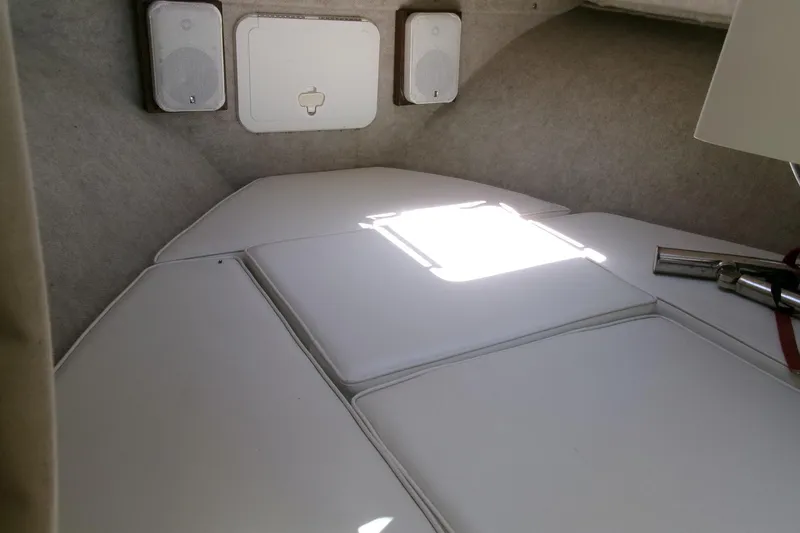 Slide: The Image of Interior cabin of 2011 Parker 2320 SL Sport Cabin boat with cushioned seating. - 14