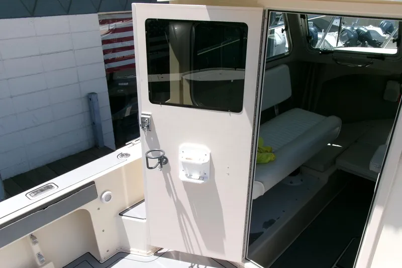 Slide: The Image of 2011 Parker 2320 SL Sport Cabin interior view with open cabin door. - 17