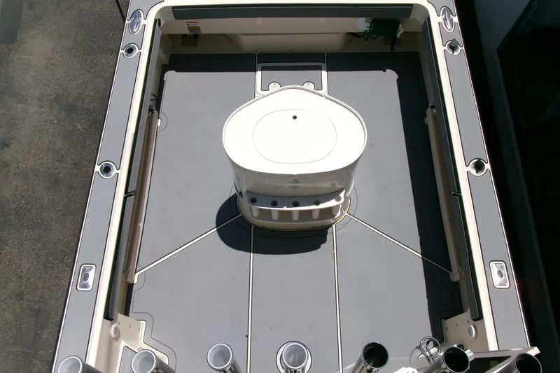 Slide: The Image of 2011 Parker 2320 SL Sport Cabin boat deck, featuring spacious layout and central console. - 18