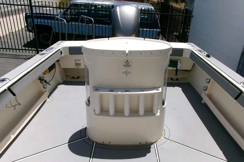Slide: The Image of 2011 Parker 2320 SL Sport Cabin boat deck with storage and rod holders. - 19