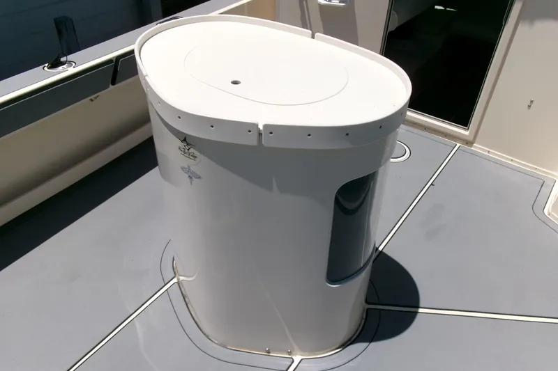 Slide: The Image of Parker 2320 SL Sport Cabin 2011 boat deck with a white cylindrical structure. - 21