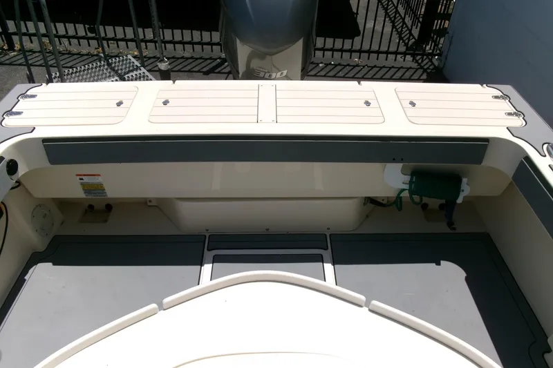 Slide: The Image of 2011 Parker 2320 SL Sport Cabin boat deck with storage compartments. - 22