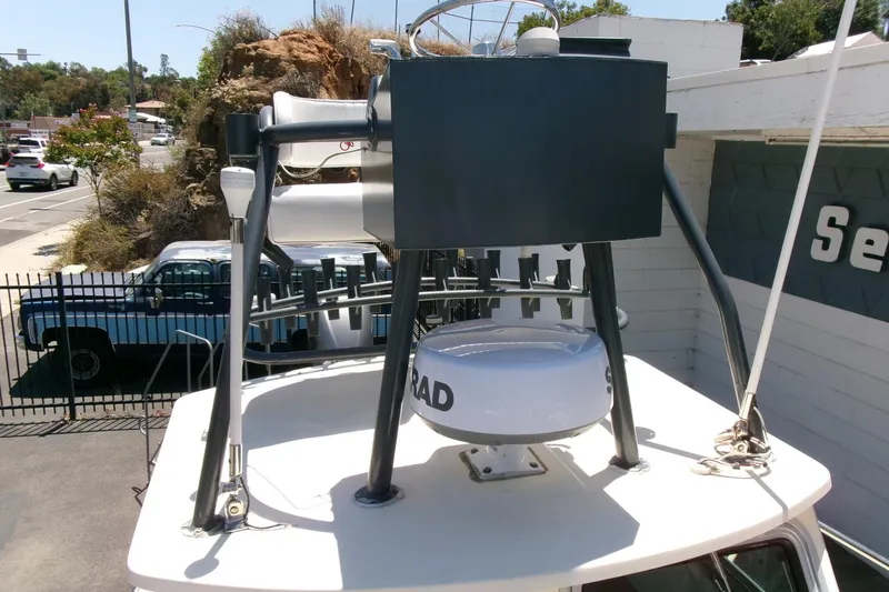 Slide: The Image of 2011 Parker 2320 SL Sport Cabin boat with radar equipment on top deck. - 5
