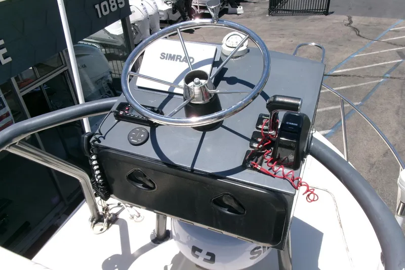 Slide: The Image of Steering console of a 2011 Parker 2320 SL Sport Cabin boat with Simrad equipment. - 6