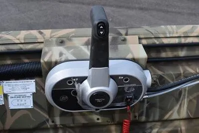 Slide: The Image of Control panel of 2025 Lowe Roughneck 1860SC boat with camouflage design. - 19