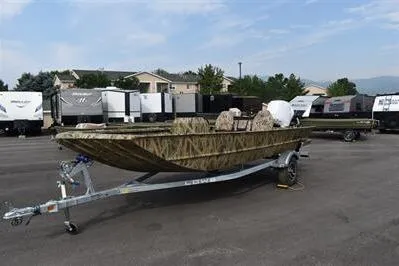 Slide: The Image of 2025 Lowe Roughneck 1860SC boat on trailer in parking lot, camo design. - 2
