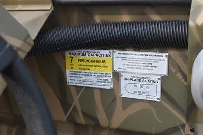 Slide: The Image of 2025 Lowe Roughneck 1860SC boat capacity and seating information labels. - 20