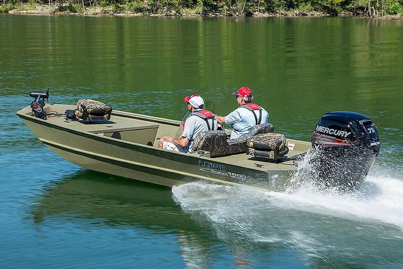 Slide: The Image of Manufacturer Provided Image: 2025 Lowe Roughneck 1860SC boat cruising on a lake with two passengers. - 21