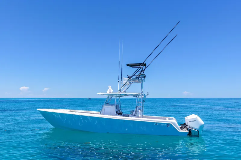 The Image of 2023 Contender 35 ST boat on clear blue ocean under sunny sky. - 0