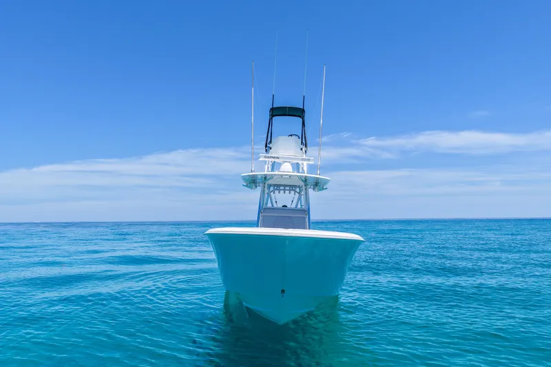 Slide: The Image of 2023 Contender 35 ST boat on clear blue ocean under sunny sky. - 10