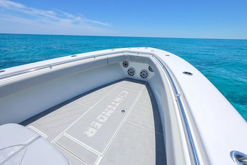 Slide: The Image of 2023 Contender 35 ST boat on clear blue ocean waters. - 12
