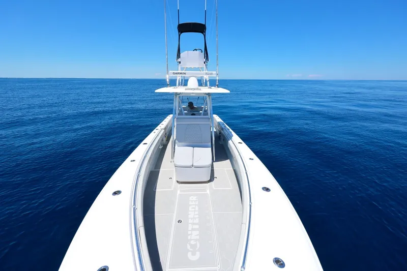 Slide: The Image of 2023 Contender 35 ST boat on open ocean under clear blue sky. - 13