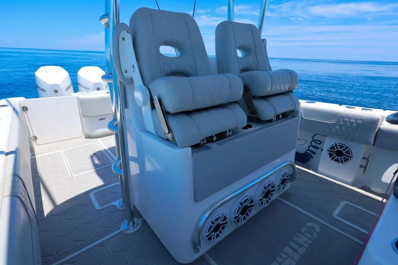 Slide: The Image of 2023 Contender 35 ST boat interior with cushioned seats and ocean view. - 15