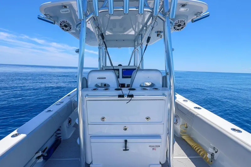Slide: The Image of 2023 Contender 35 ST boat on open ocean, featuring sleek design and advanced navigation equipment. - 21