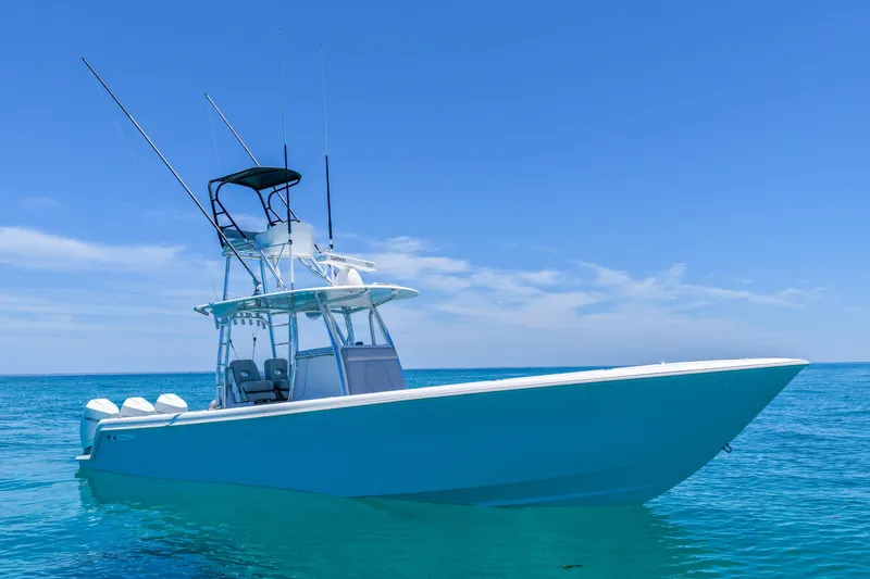 Slide: The Image of 2023 Contender 35 ST boat on clear blue ocean under sunny sky. - 3
