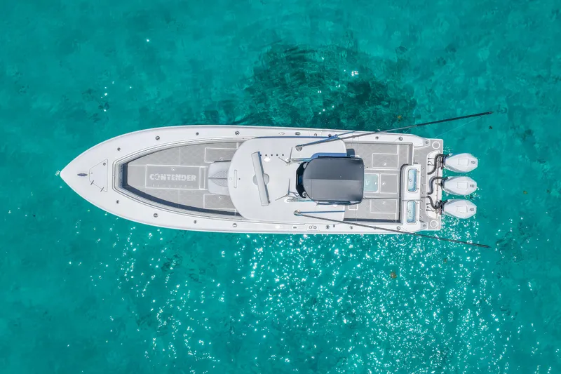 Slide: The Image of Aerial view of 2023 Contender 35 ST boat on clear turquoise water. - 5