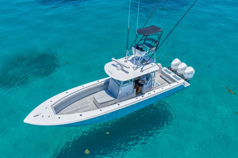 Slide: The Image of 2023 Contender 35 ST boat on clear turquoise water, aerial view. - 6