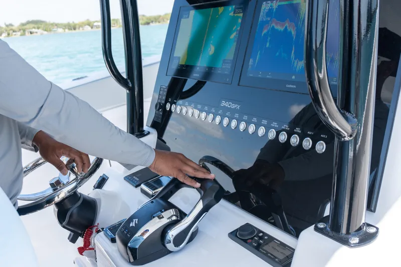 Slide: The Image of 2026 Twin Vee 340 GFX CC boat dashboard with advanced navigation controls and displays. - 11