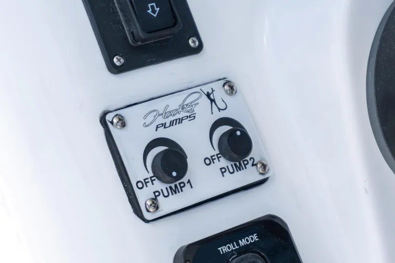 Slide: The Image of Control panel of 2026 Twin Vee 340 GFX CC with Hooker Pumps switches. - 12