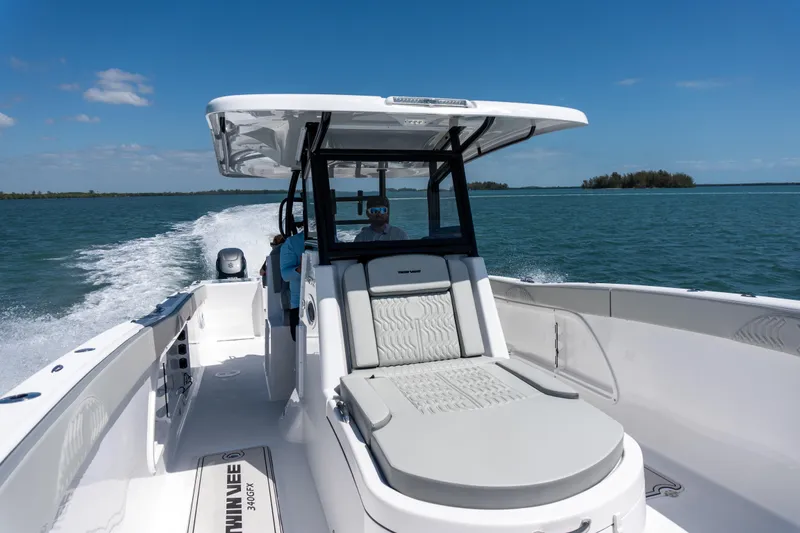 Slide: The Image of 2026 Twin Vee 340 GFX CC cruising on open water under clear blue skies. - 4